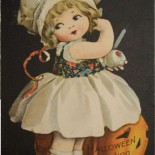 Vintage Postcard of a Halloween Girl Carving an Apple