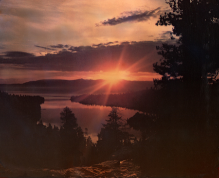 Vintage Lake Tahoe Postcard showing the sunrise over Emerald Bay